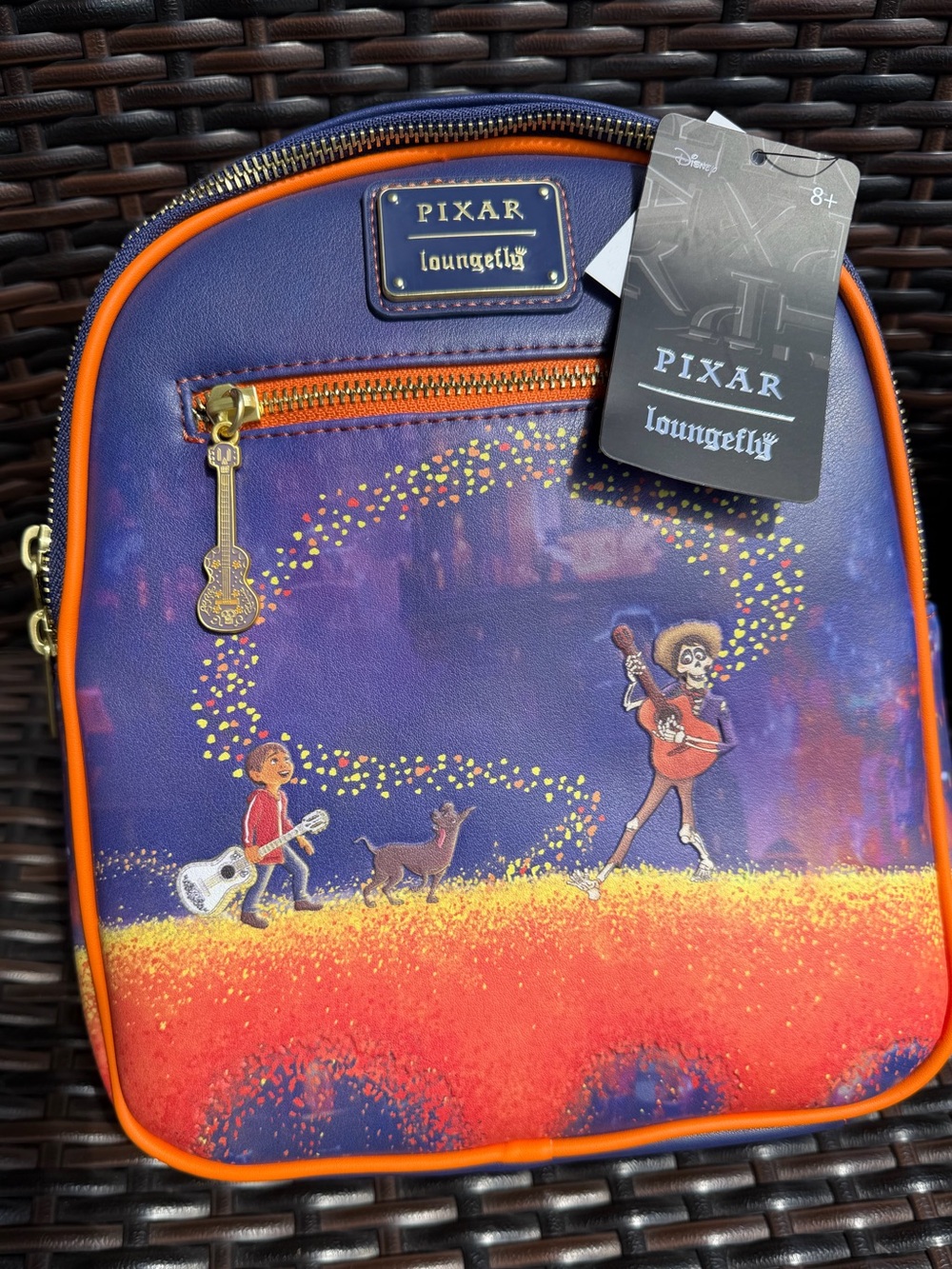 Loungefly Pixar Coco Crossbody Bag in Purple & Orange